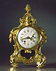 A very fine small Louis XV gilt bronze mantle clock by Charles Le Roy